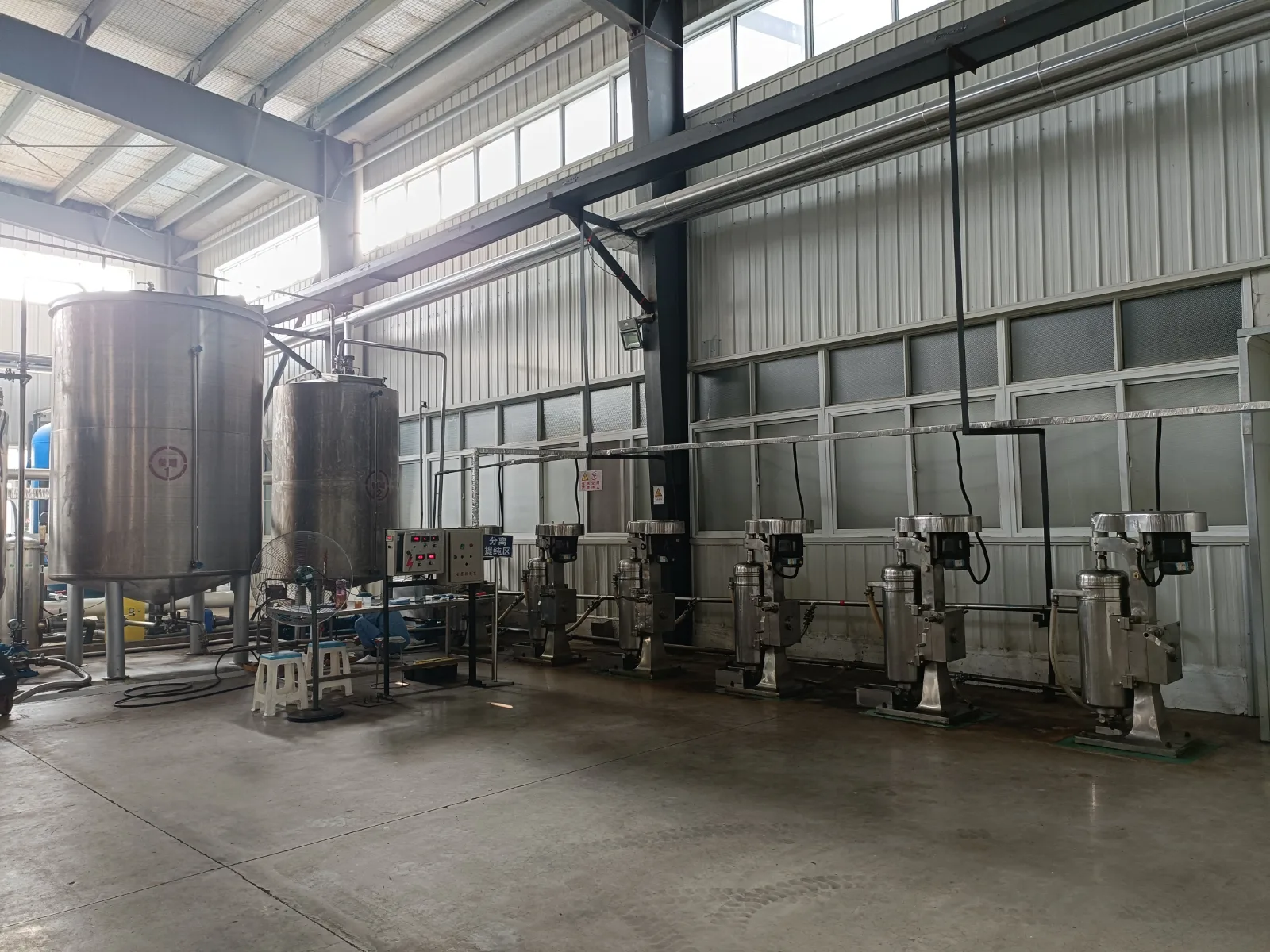 Separation and purification area with centrifuge separators inside the Nutranexa workshop