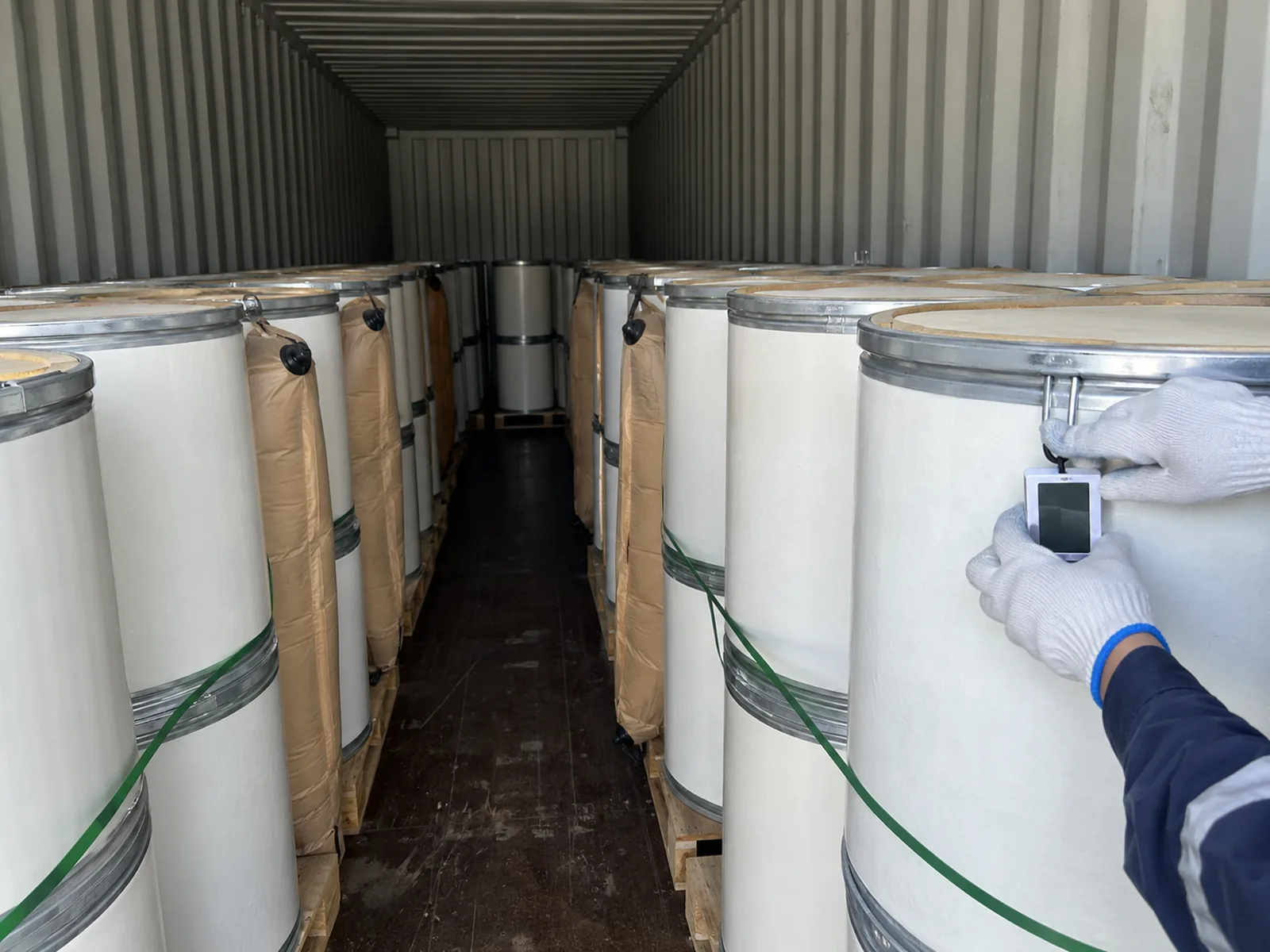 Fiber drums with a temperature data logger inside a container