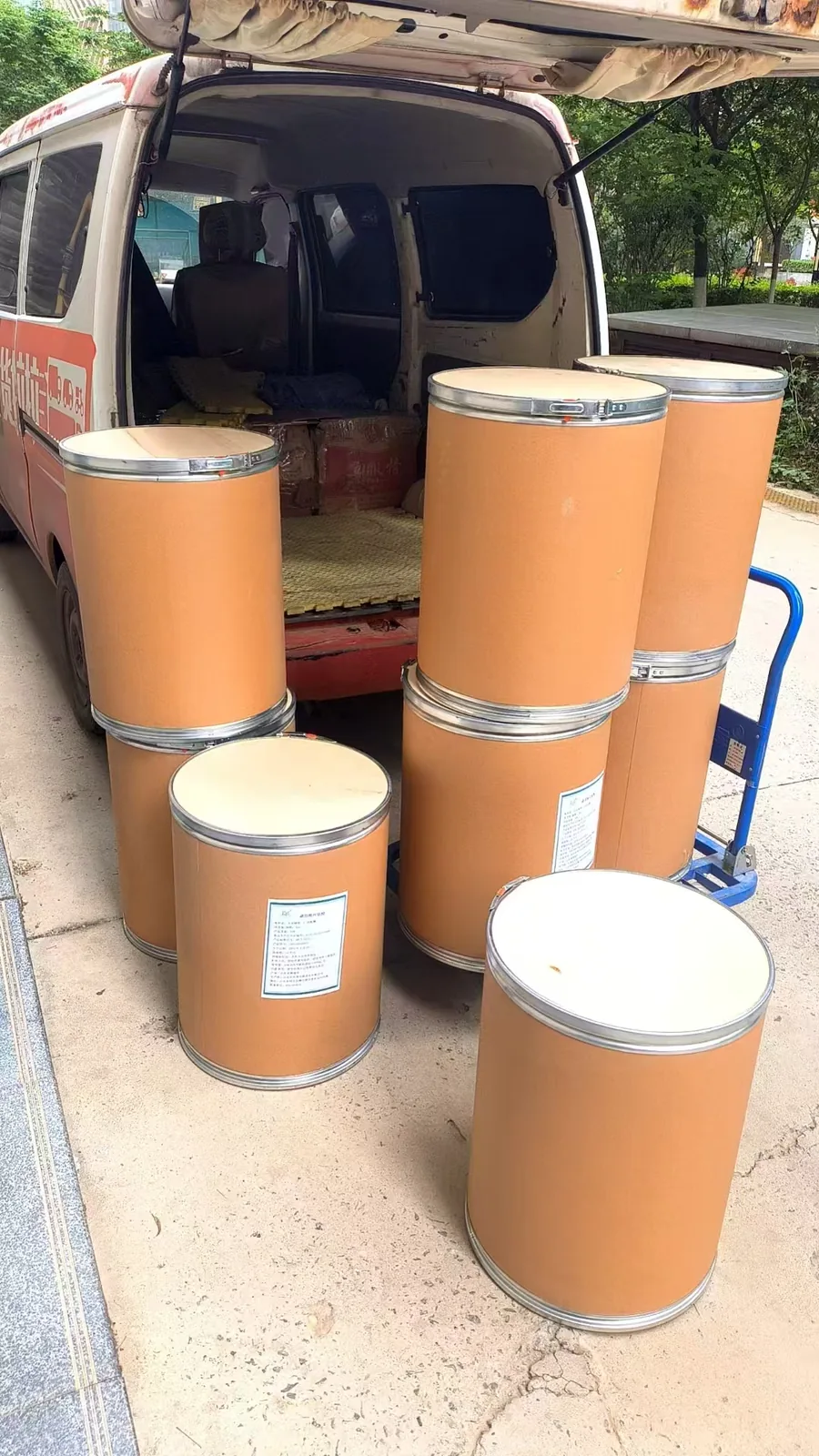 Palletized ingredient drums loaded onto a truck